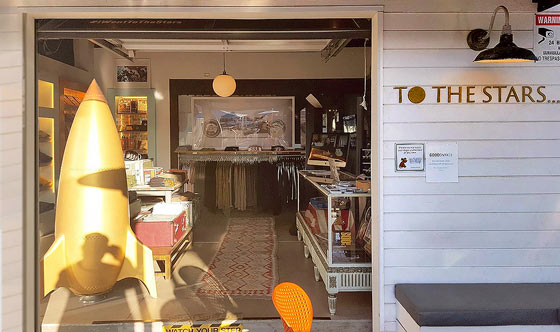Figure 1: To The Stars flagship retail store in Encinitas, CA sells hats, coffee cups, T-shirts, and books by Tom DeLonge.